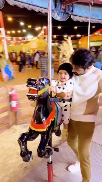 Baby Raya is taken to the carnival by Sadia Ghaffar and Hassan Hayat.