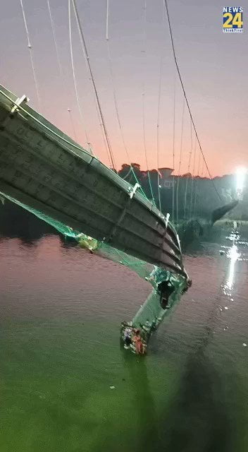 Watch as a suspension bridge in Gujarat, India, falls. At least 134 persons passed away.